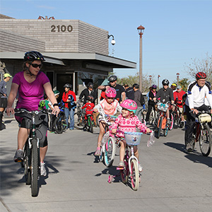 Family riding bikes at the Chandler Family Bike Ride