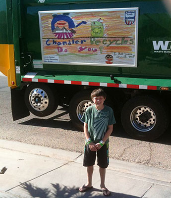 kid standing in front of garbage truck