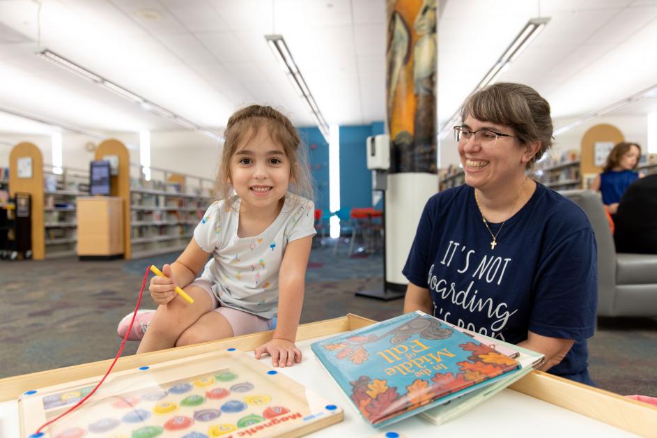 daughter-and-mom-at-library-activity-table