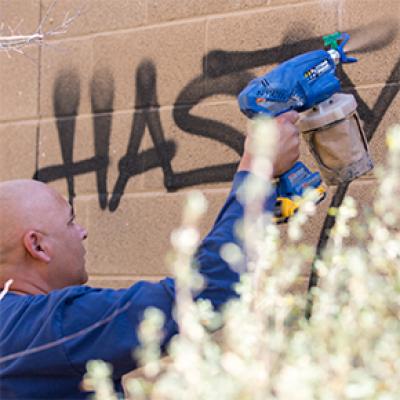 Chandler employee removing graffiti
