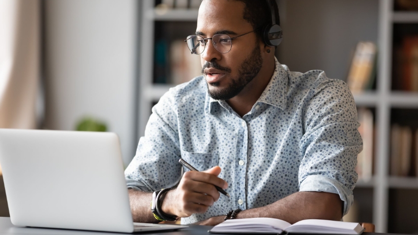 man working from home on laptop