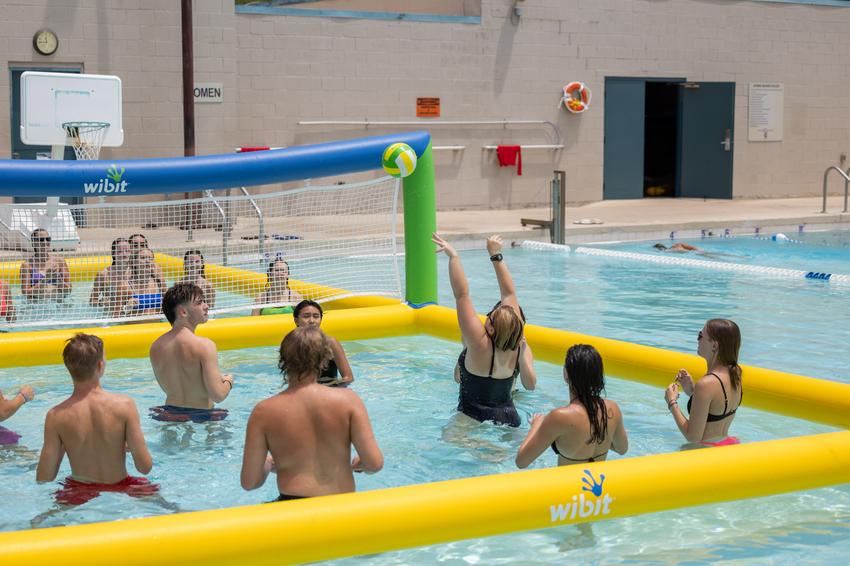 teen pool party volleyball