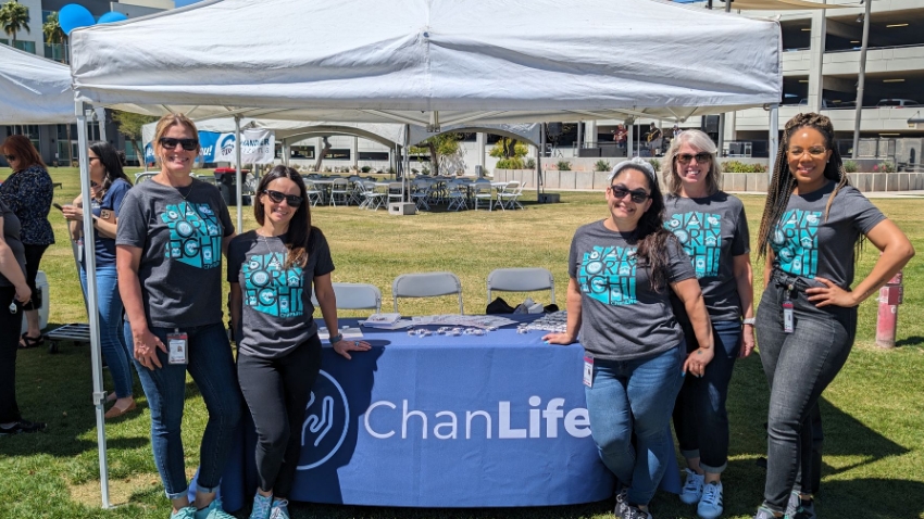 City employees covering a ChanLife booth