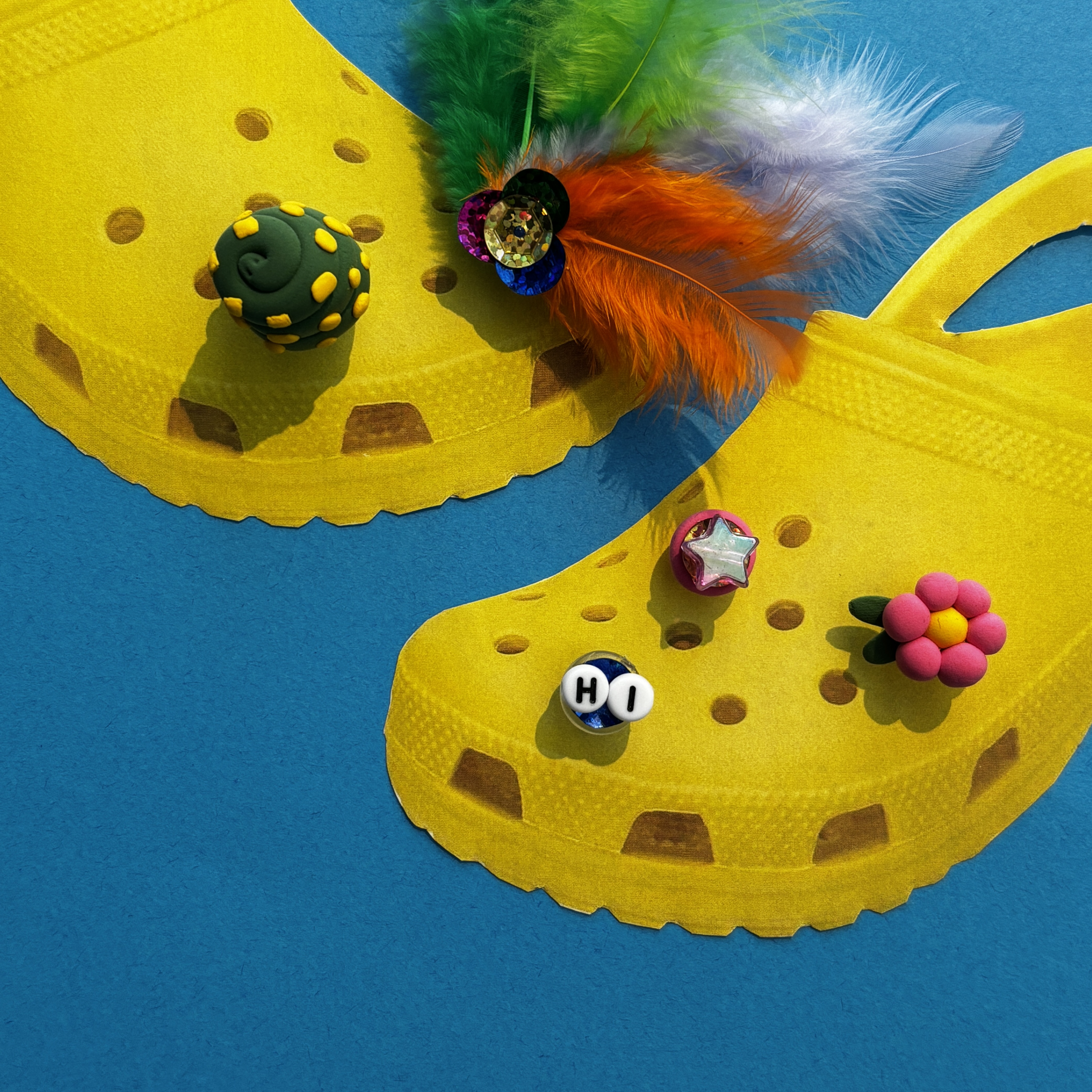 Promotional graphic for "Make and Take: Clog Shoe Charms" featuring yellow crocs with jibbitz made from air-dry clay, sequins, beads, feathers, and more. This event happens on September 28 11am-1pm