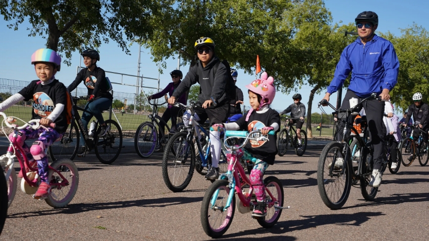 Family riding bikes at the Chandler Family Bike Ride