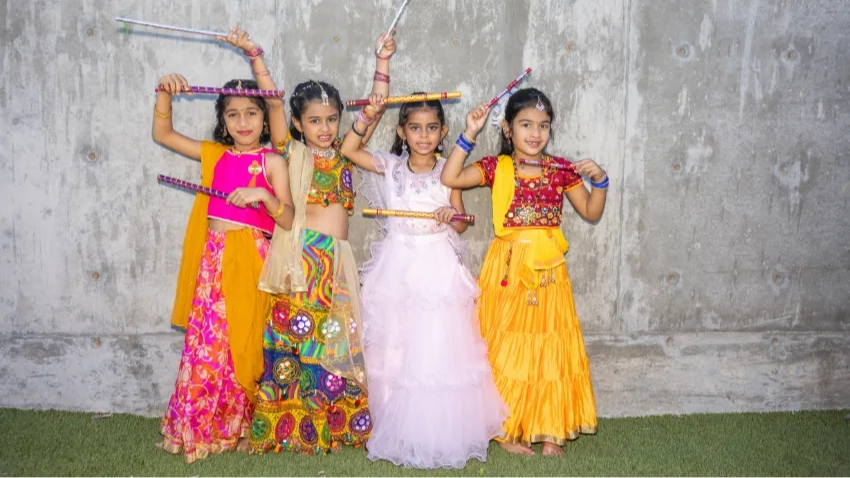 Four dancers celebrating Diwali