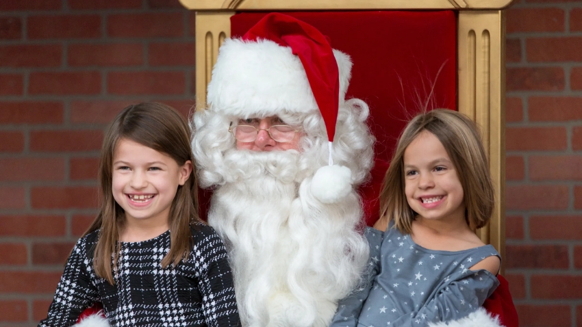 sisters sitting on Santa's lap