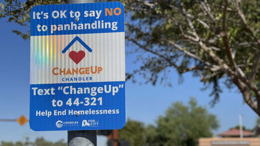 Change Up sign on a light pole