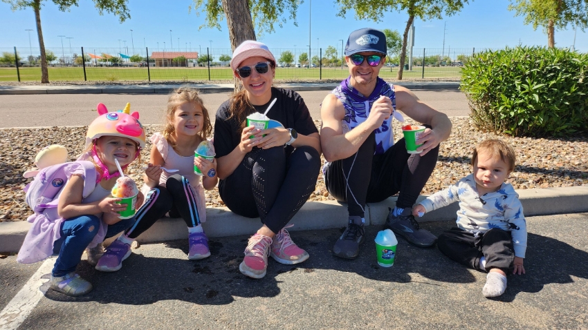 Family Bike Ride: Family enjoying snow cones