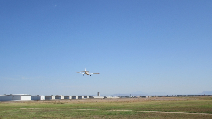 Small plane landing at the Chandler Airport Small plane landing at the Chandler Airport
