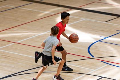 Kids pickup basketball and volleyball on the UWS!