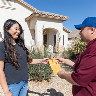 Chandler Utility Services employee helping a resident