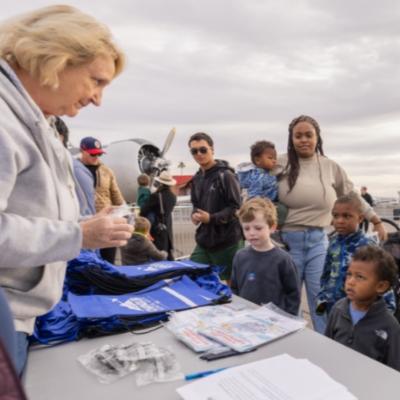 people gathering information at Airport Days