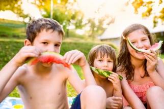 Three Children Eating Watermelon
