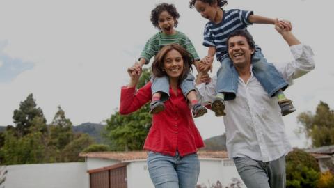 Set of parents with kids on shoulders