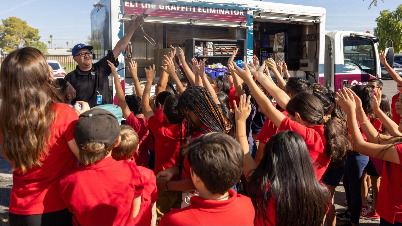 kids surrounding the graffiti truck