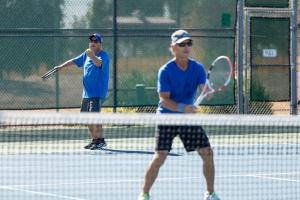 two men playing tennis