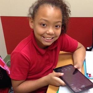 Throughout their year in ASPIRE Read to Succeed, students work on a tablet to play educational games and practice literacy skills they’ll use in school. 